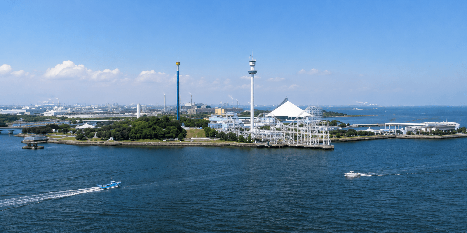 Yokohama Hakkeijima Sea Paradise island complex with the Aqua Museum aquarium building and Surf Coaster Leviathan track running out over the bay